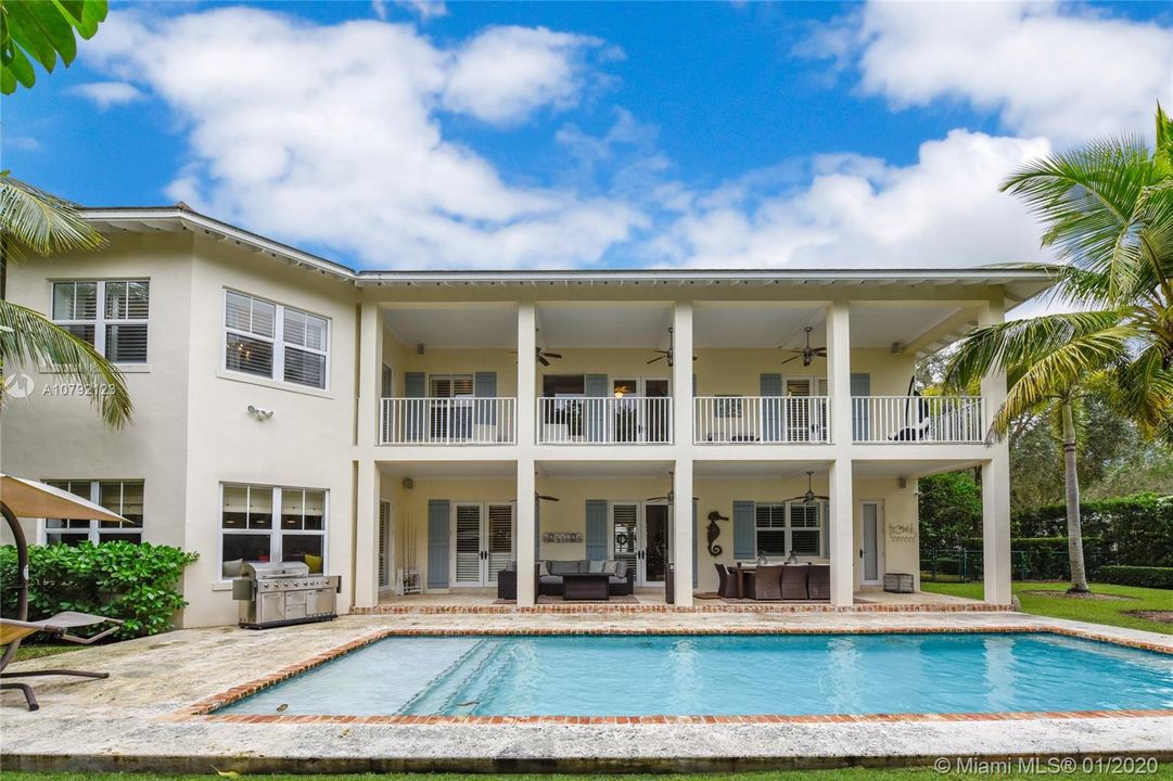 Rear Elevation. Access to patio from all rooms. Ceiling fans throughout. Salt water Pool.