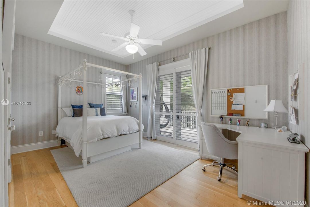 One of Two bedrooms that share a Jack & Jill bathroom. The 2nd floor terrace faces the pool.