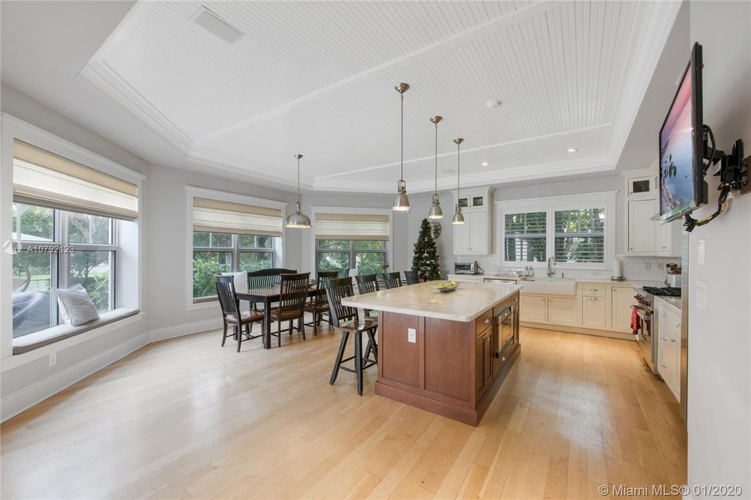 Kitchen with Bay Windows and Breakfast Nook. Coffered ceiling. Hardwood floor.