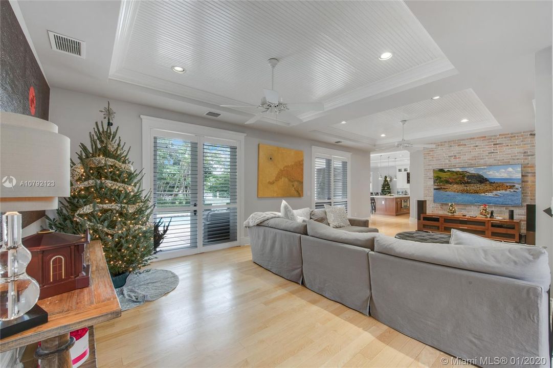 First floor family room. Double-doors leading to patio, pool and waterway.