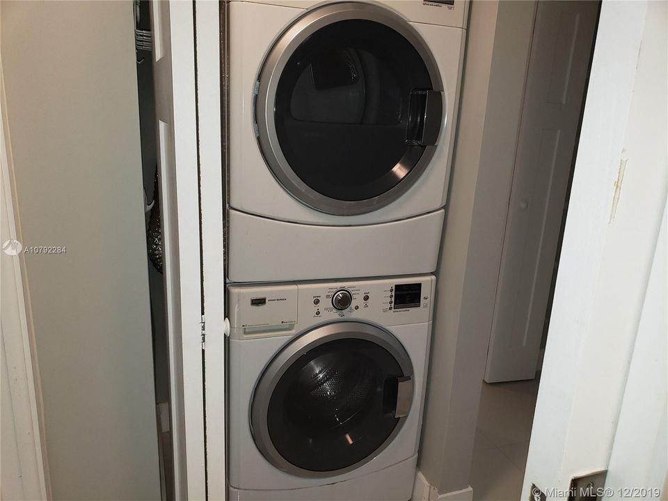 Like new stacked full size washer and dryer.