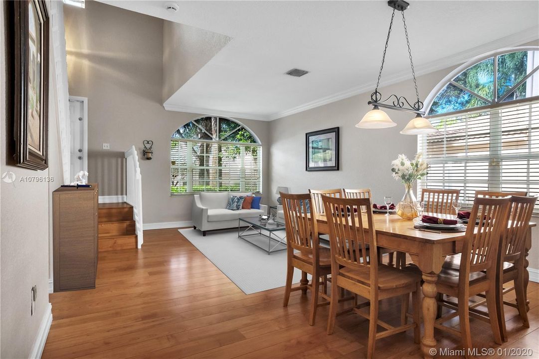 This comfortable & gracious 2-story single family home with its high volume ceiling entry, light wood flooring and crown molding throughout welcomes you in