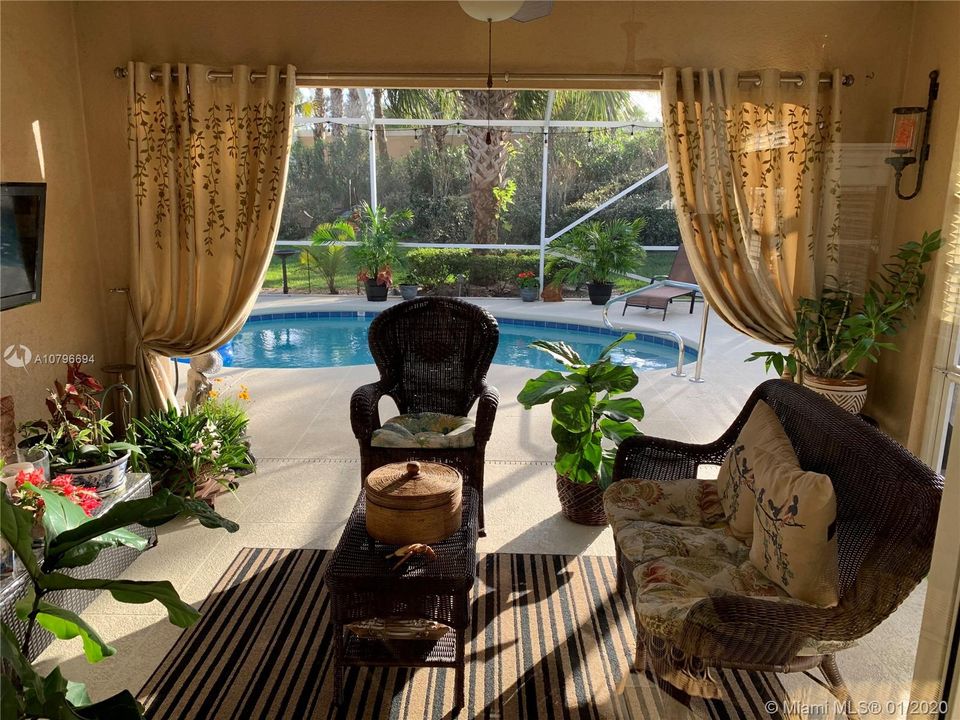 Cozy Screened enclosed patio right off the pool.