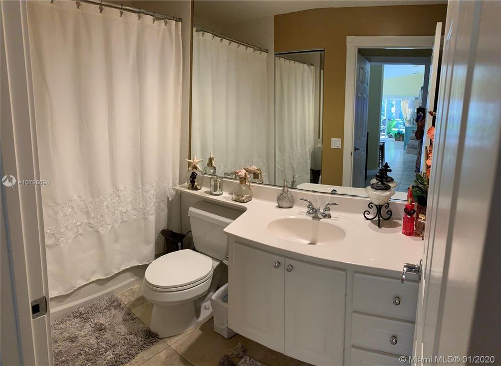 Guest bathroom has a tub