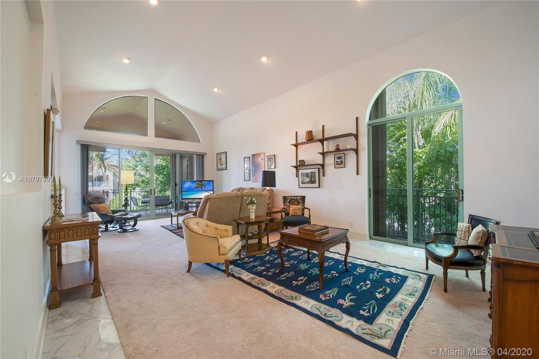 Volume Ceilings & Lots of Natural Light in this Corner Unit!