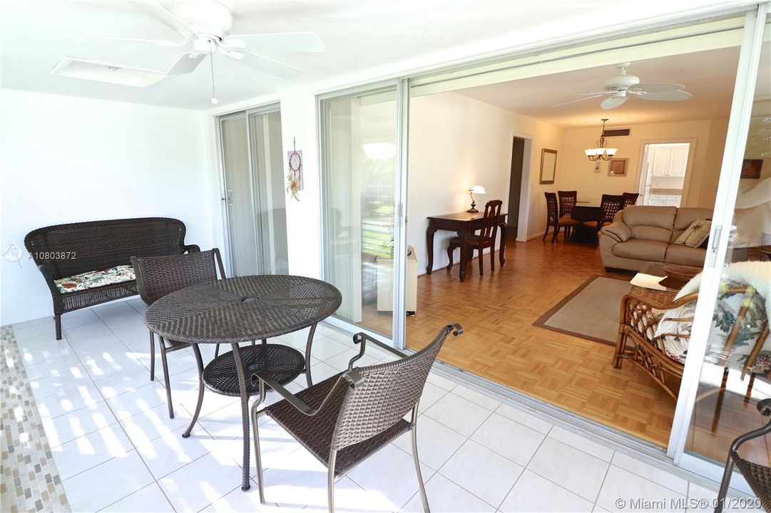 Lanai with screens, tile floor and sliding glass windows