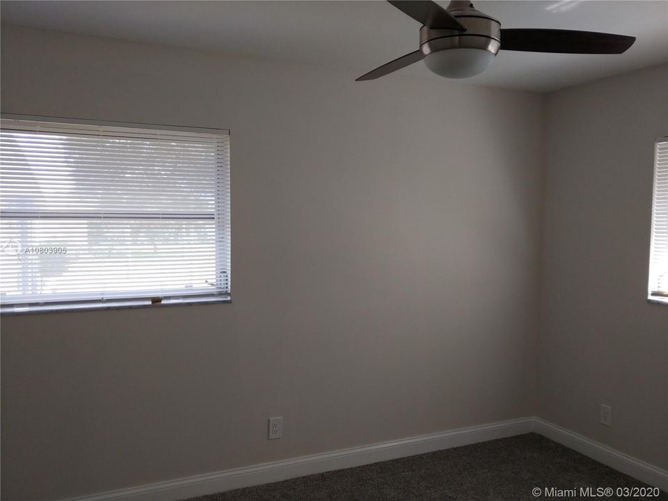 Bright Master Bedroom, freshly painted, new carpet, fan, blinds with large walk in closet.