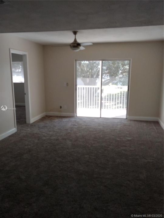 Bright Living/Dining ,new carpet, paint, lighting ,fan.