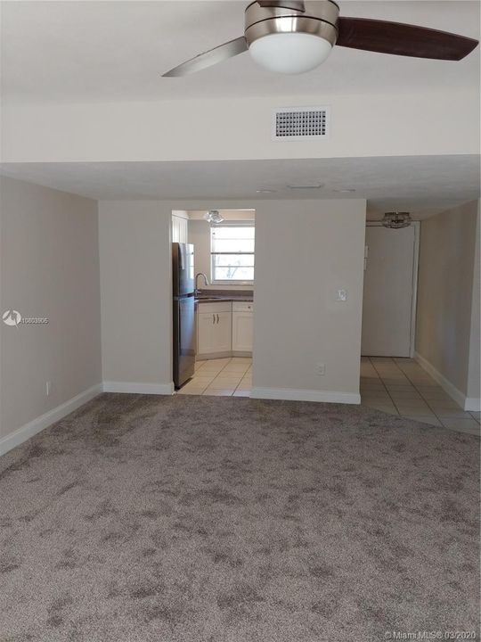 Views from Living room back to kitchen and front hallway.