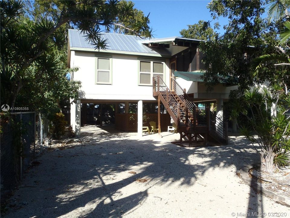 Front View, 60' x 100' Lot with Plenty of Open Yard Space, Ocean Side Property Across Community Boat Ramp & Park.