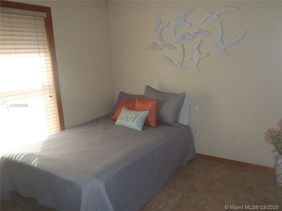 Bedroom 2, 60' x 100' Lot with Plenty of Open Yard Space, Ocean Side Property Across Community Boat Ramp & Park.