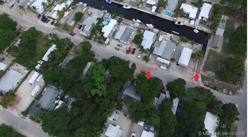 Property is 2 Lots Across from Boat Ramp & Park. 60' x 100' Lot with Plenty of Open Yard Space, Ocean Side Property Across Community Boat Ramp & Park.