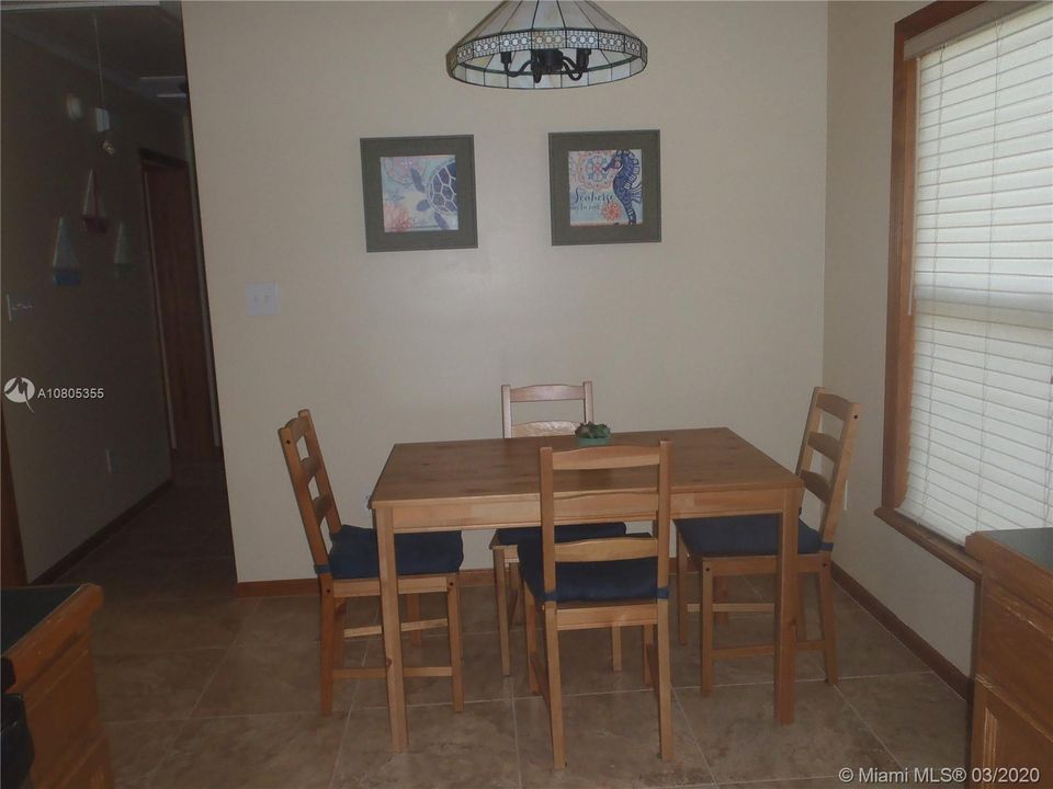 Dining Area View 2, 60' x 100' Lot with Plenty of Open Yard Space, Ocean Side Property Across Community Boat Ramp & Park.