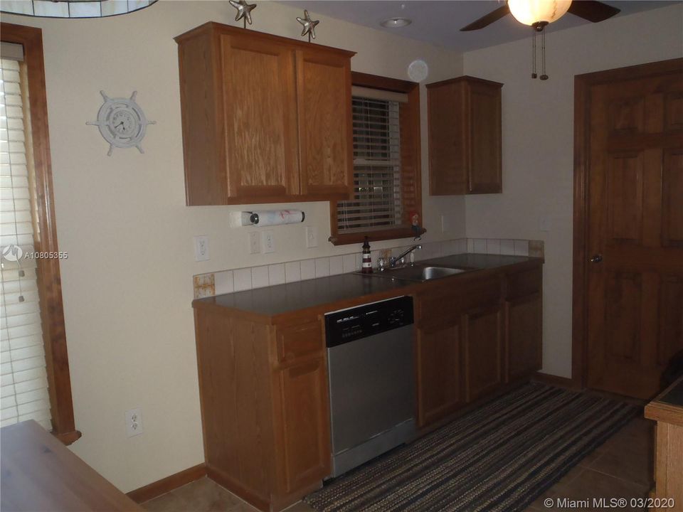 Kitchen View 1, 60' x 100' Lot with Plenty of Open Yard Space, Ocean Side Property Across Community Boat Ramp & Park.