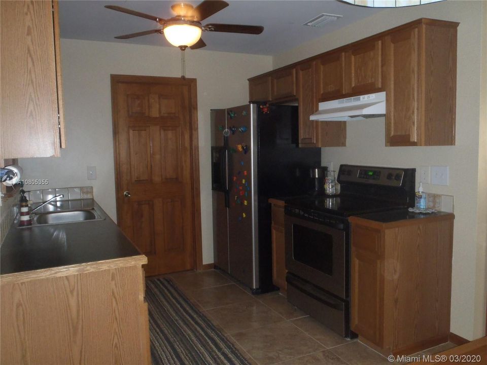 Kitchen View 2, 60' x 100' Lot with Plenty of Open Yard Space, Ocean Side Property Across Community Boat Ramp & Park.