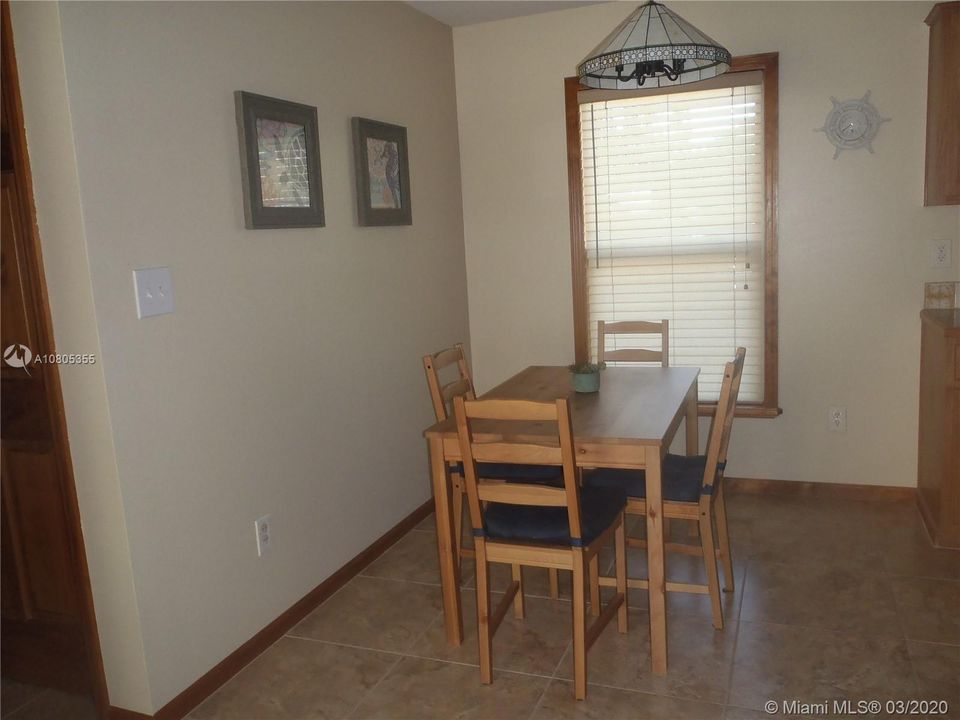 Dining Area View 1, 60' x 100' Lot with Plenty of Open Yard Space, Ocean Side Property Across Community Boat Ramp & Park.