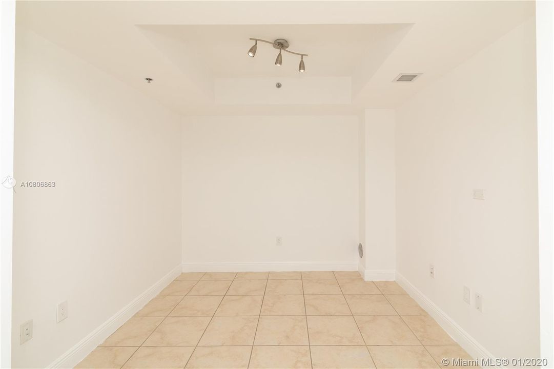 Spacious Den on the first floor is ideal as a home office and/or guest room