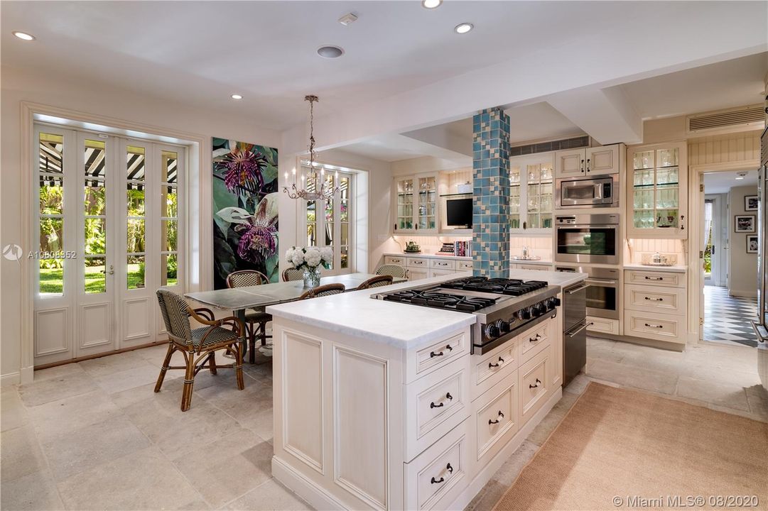 The kitchen is surrounded by natural light