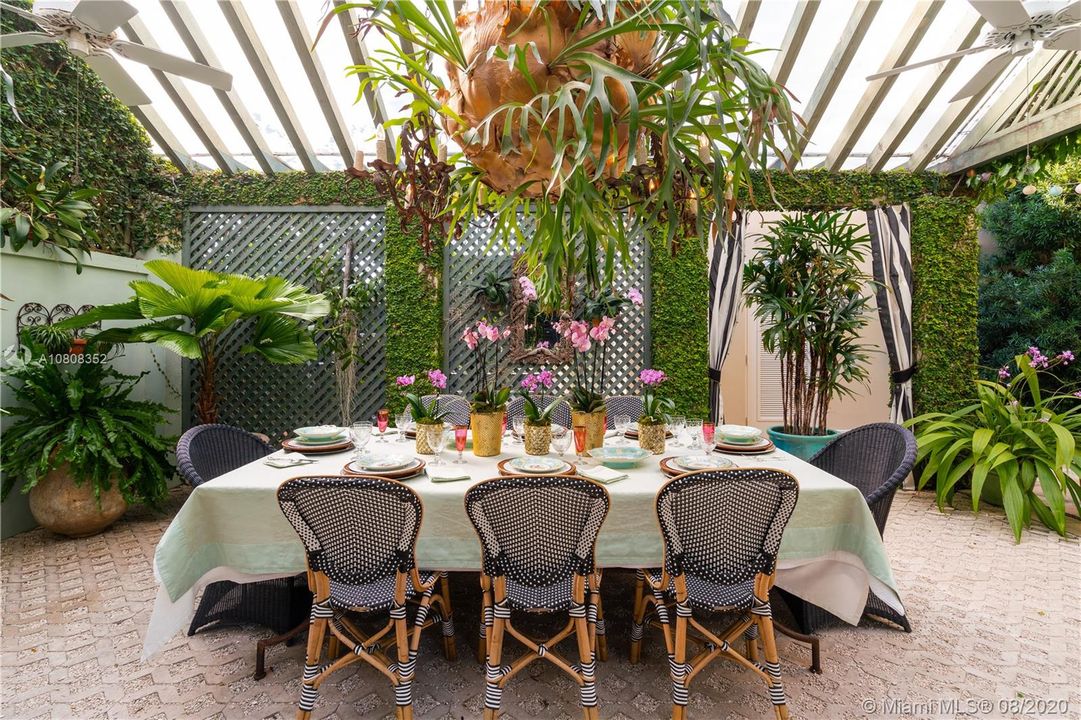 Covered pergola lets guest enjoy dining under the stars