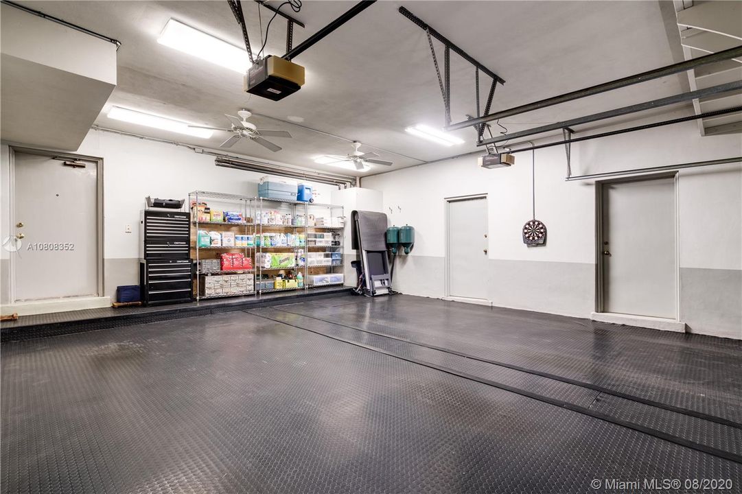 Spacious 2 car garage with 2 huge air conditioned storage rooms