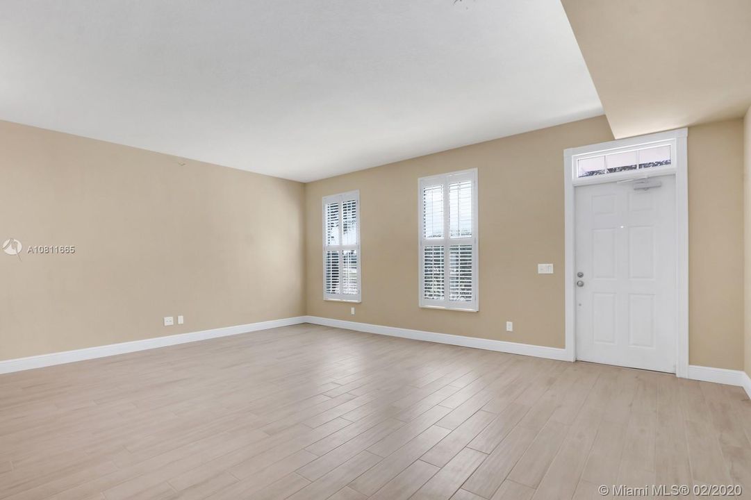 Great room with wood looking tile.