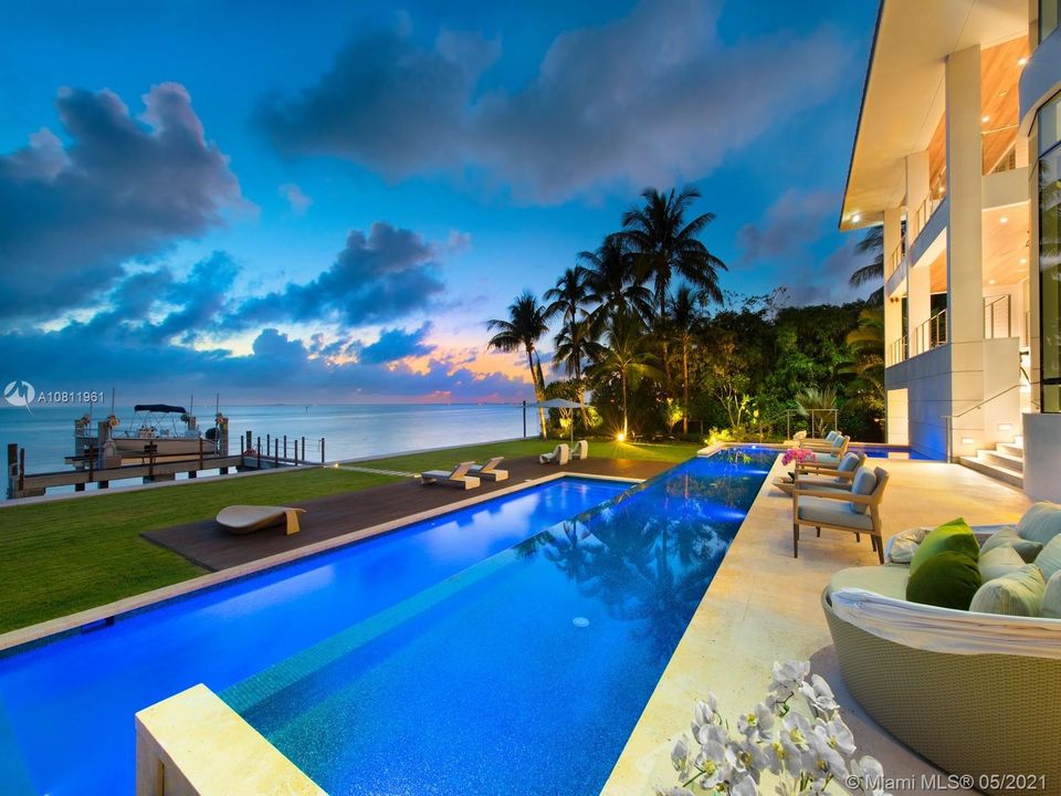 Sunset view of patio and pool.