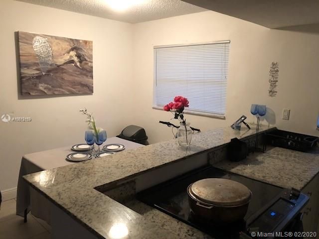 Kitchen island/counter overlooking dining area