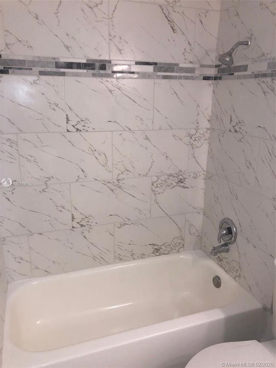 Guest bathroom with newly installed tiles