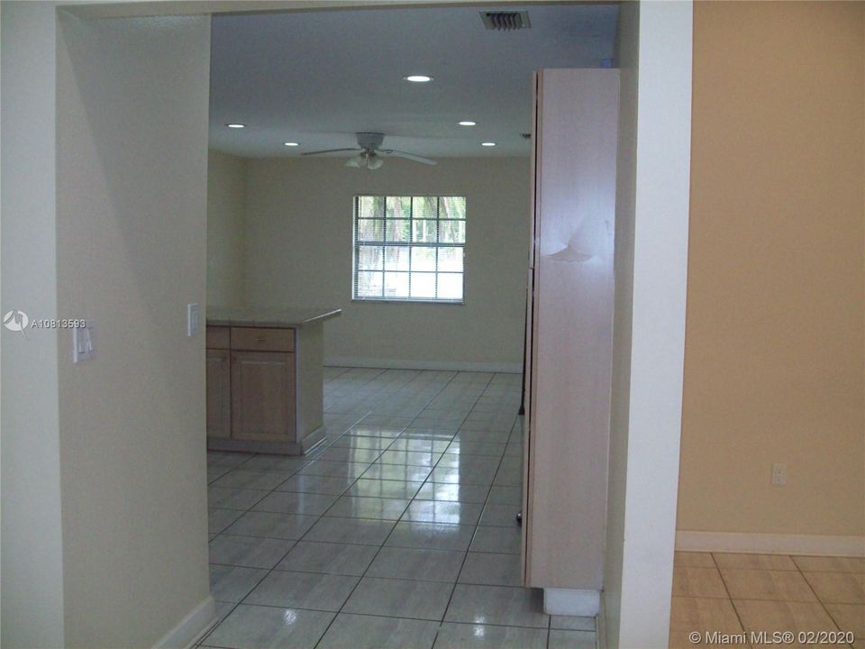 Passage way to Kitchen, dining room or garage