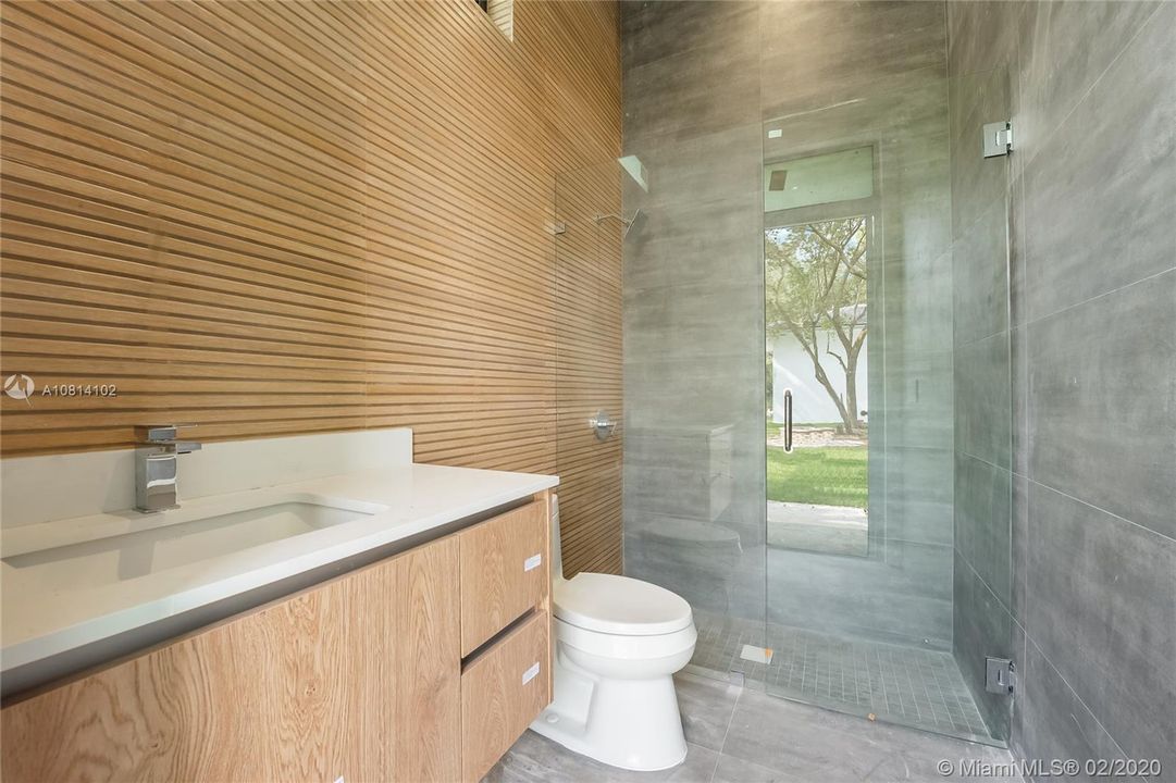 Outside cabana bath with full glass enclosed shower