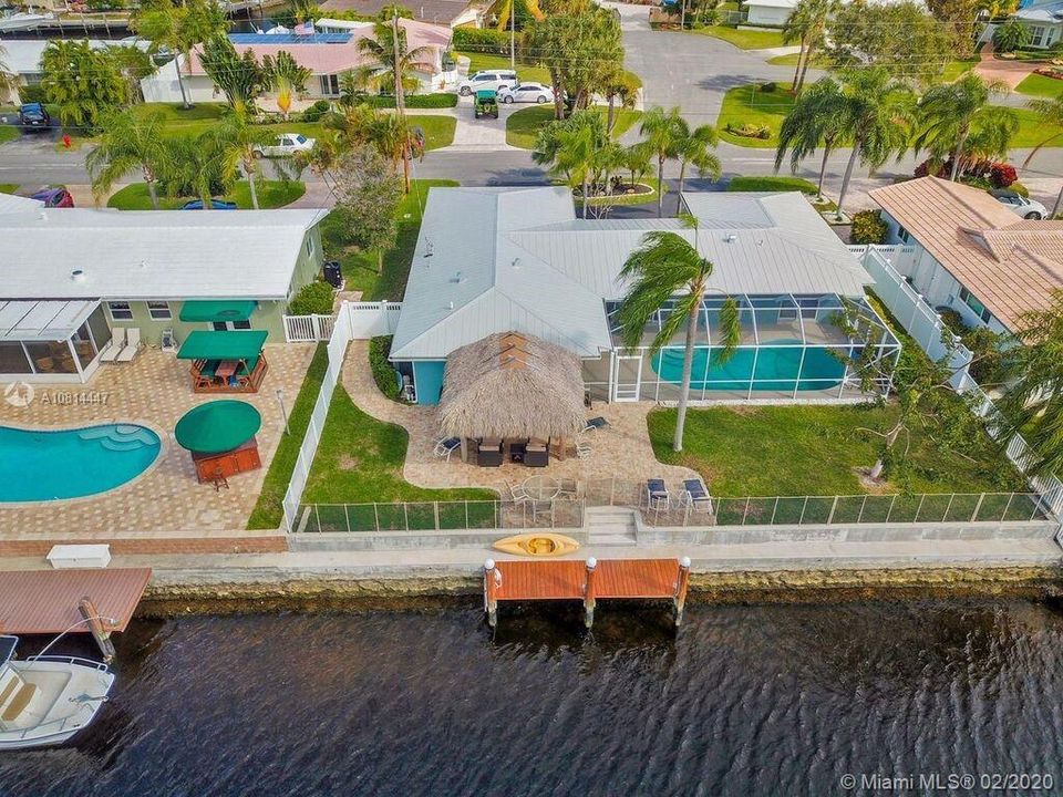 Check out the view overlooking the canal from the rear of the house. New elevated seawall and dock