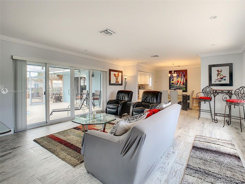 Enter into the Family/Living Room area offered natural lighting from both the front and rear of the home.