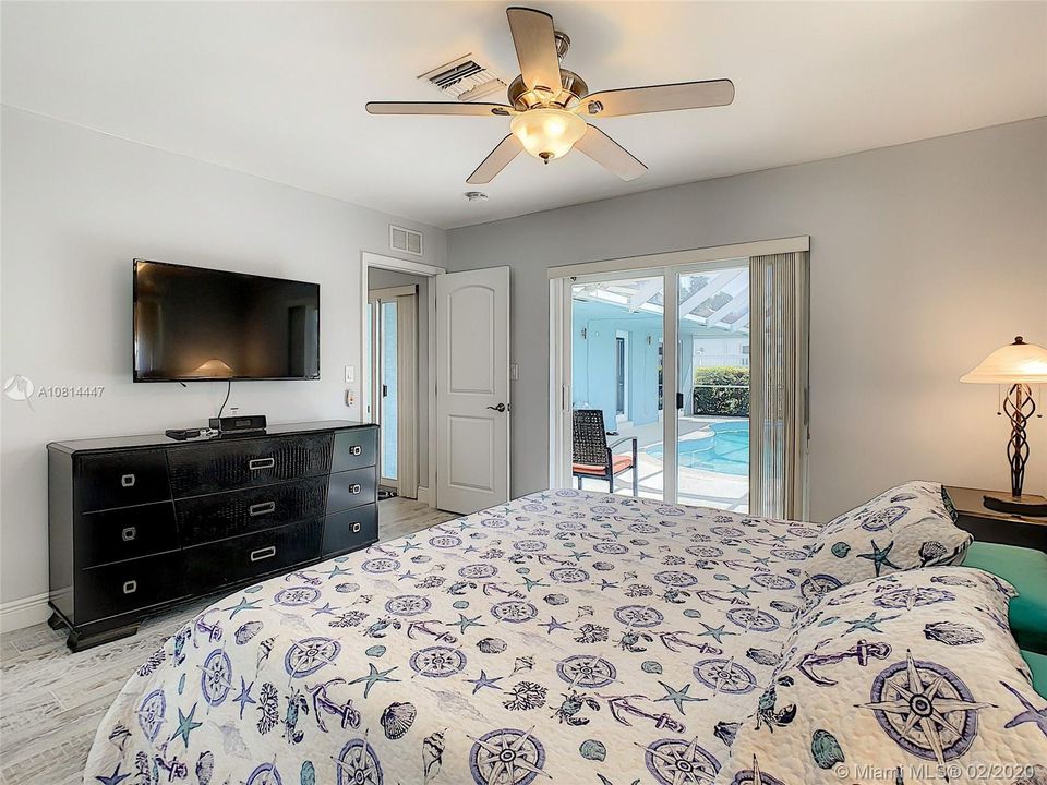 Overlooking the pool area from the Master Bedroom b