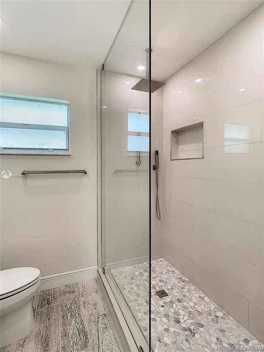 Master Bathroom Seamless Shower doors with Rain Sensor Shower.