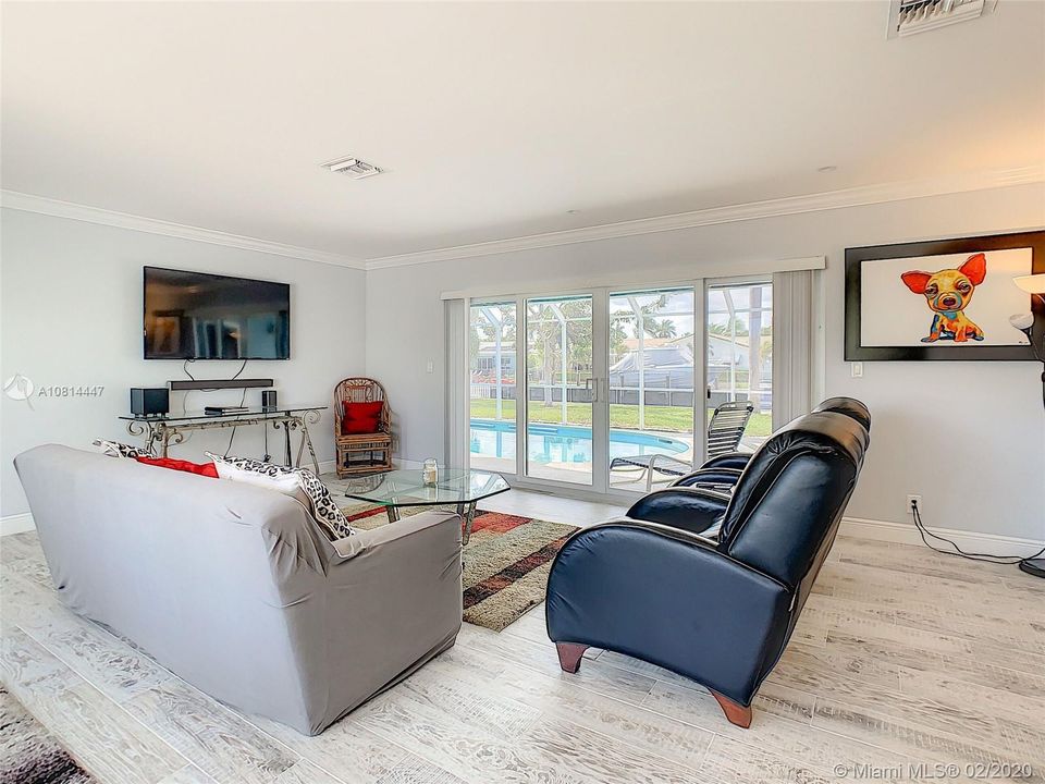 Family Living Area over looking the rear patio and pool.