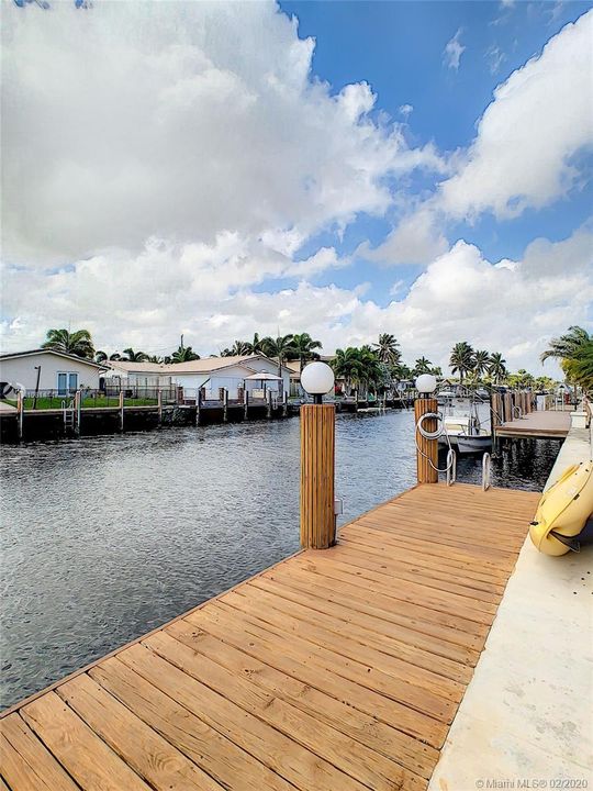 New dock is adjacent to the new elevated updated seawall. No expense was spared on this home.