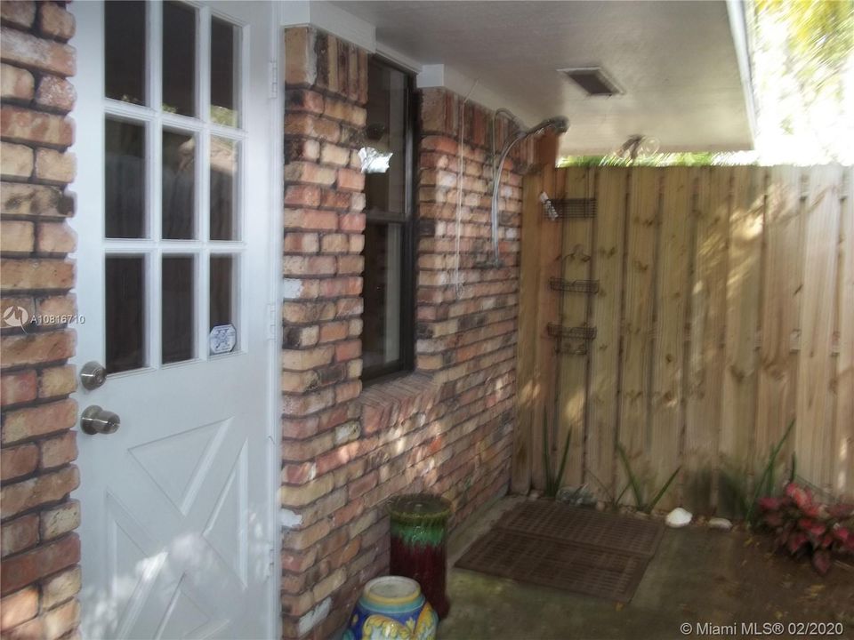 Outdoor shower area off of master bath