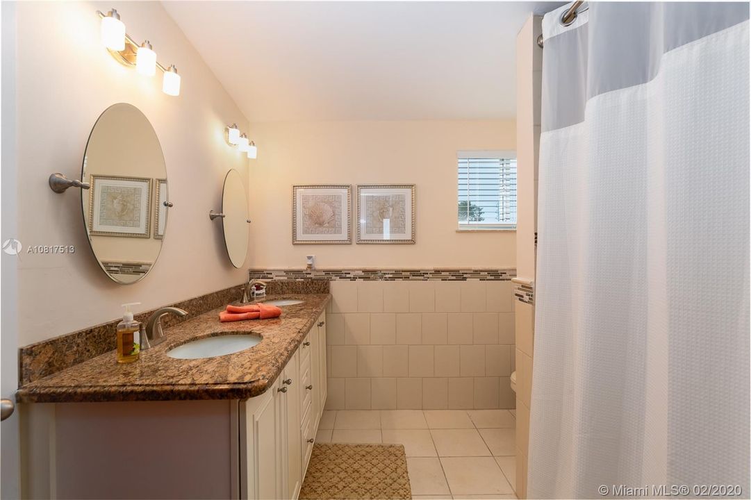 main floor hall bath opens to guest bedroom