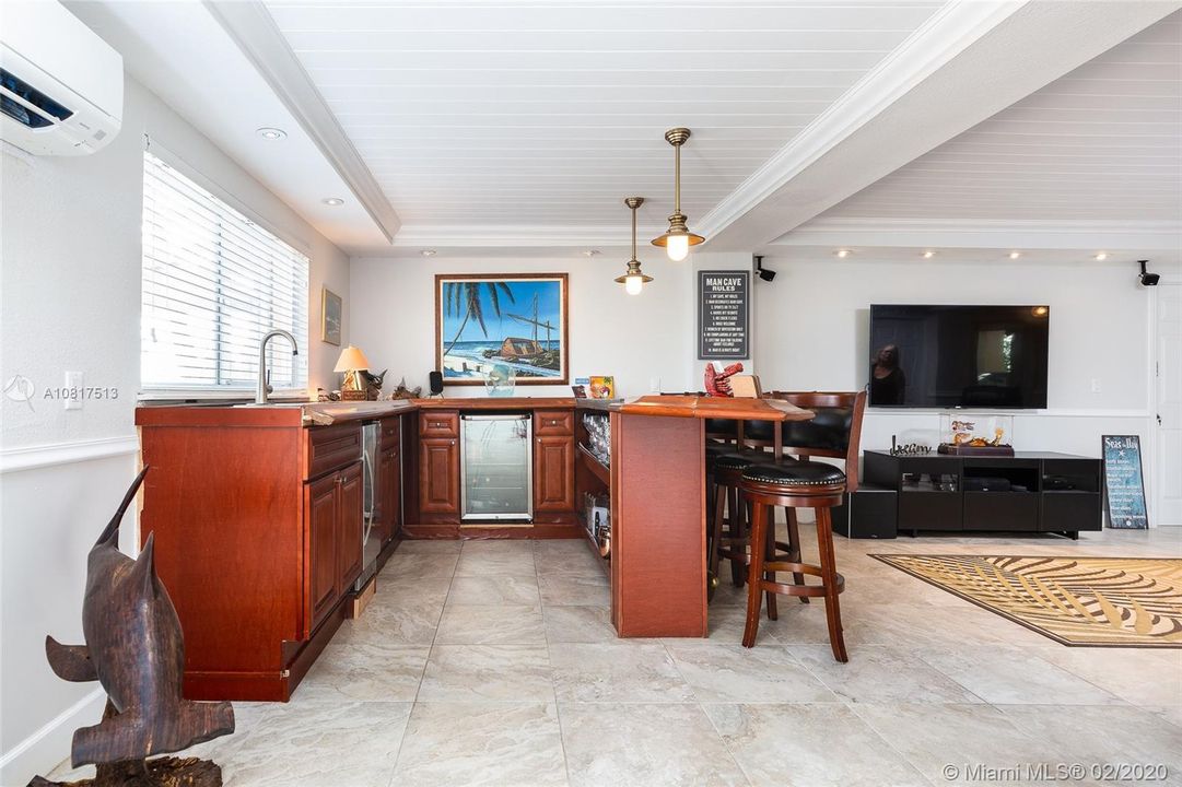 Bar area with icemaker and beverage cooler