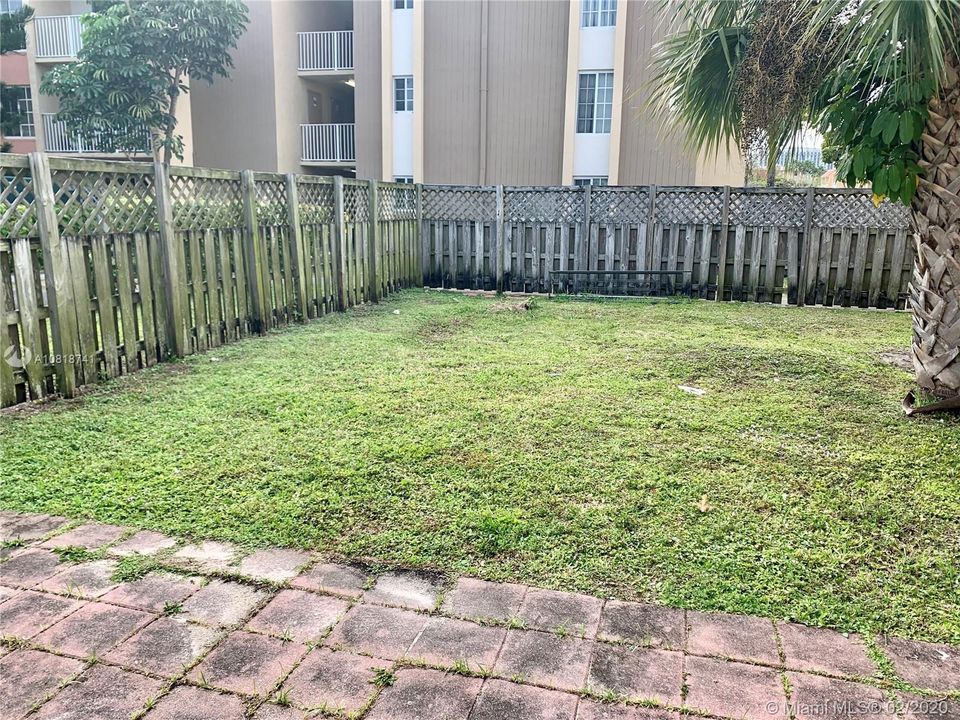 Corner unit, very large backyard.