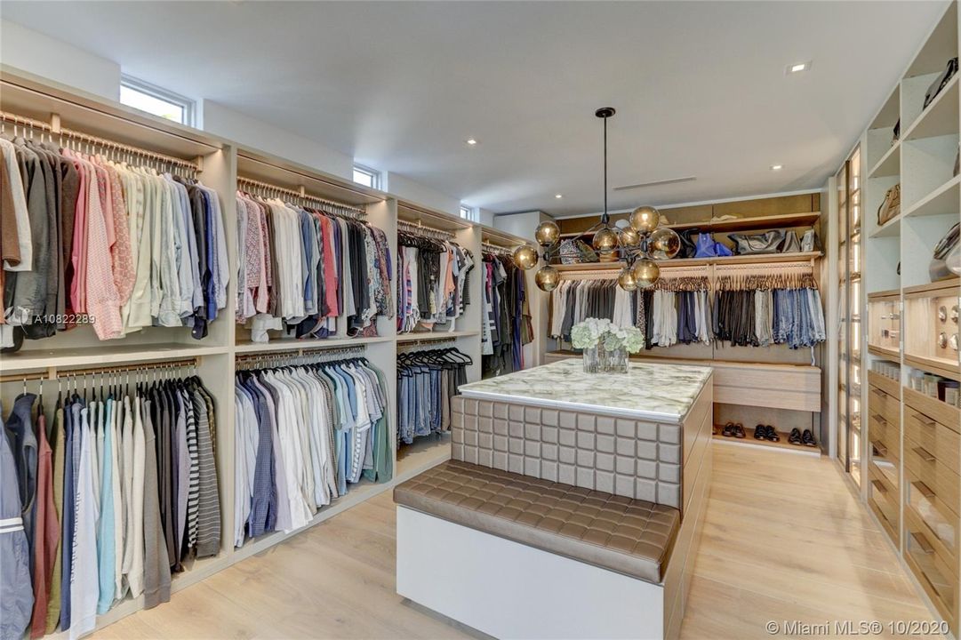 Master Closet w/ Semi Precious Stone underlit counter, Leather Stitched Bench, Drawers w/ Leather & Glass, Backpanel in Leather