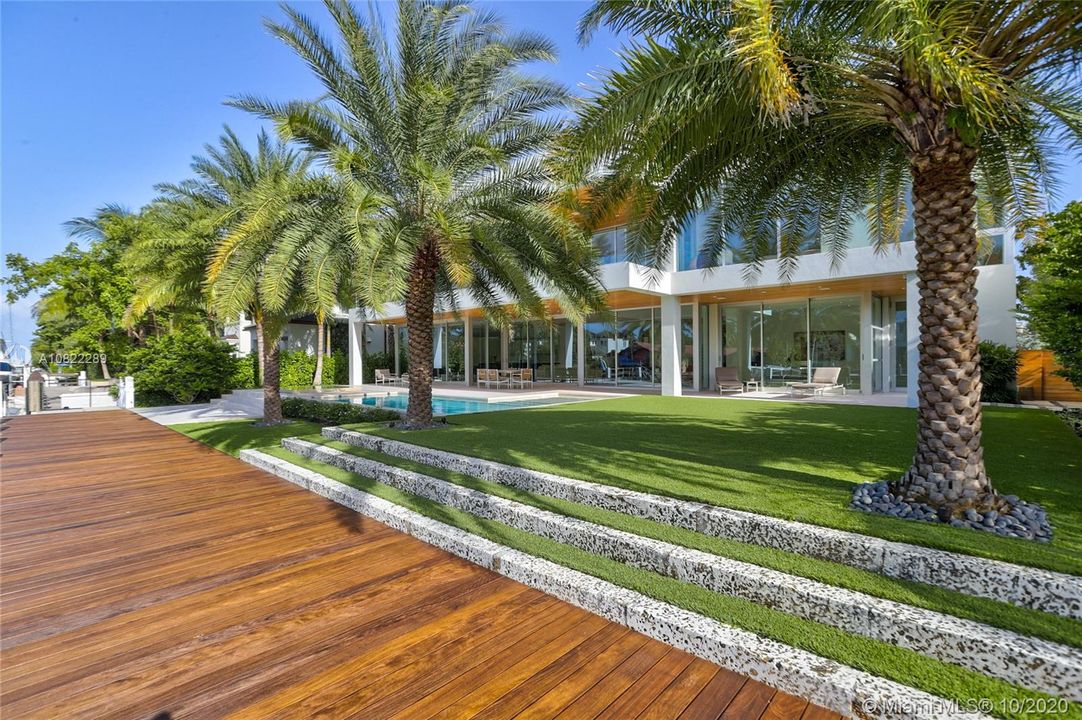 Backyard faces to the North - preferred exposure for breeze and filtered light throughout day to enjoy the outdoors. New Ipe Dock and Seawall