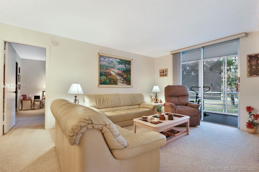 Living Room Features Sliding Door to the Large Screened Patio