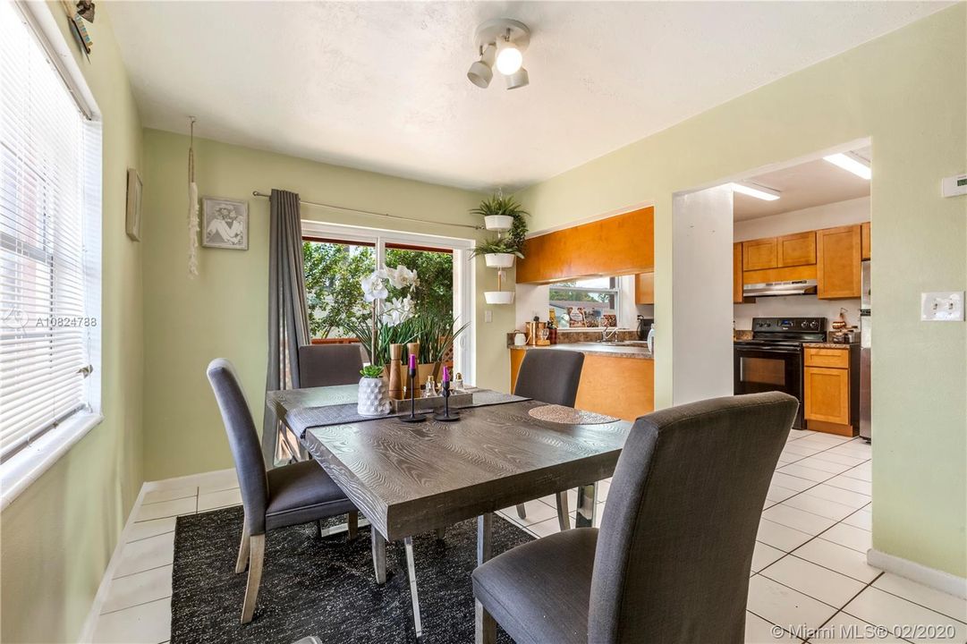 Unit #2 Dining Area with partial view of kitchen