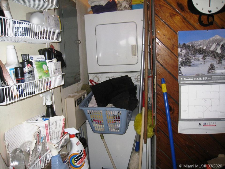 Stack Washer & Dryer near the kitchen