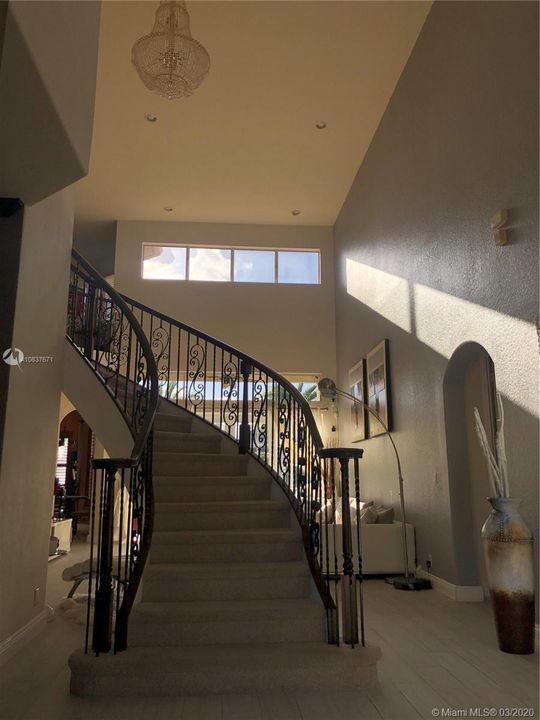 Entryway with grand staircase