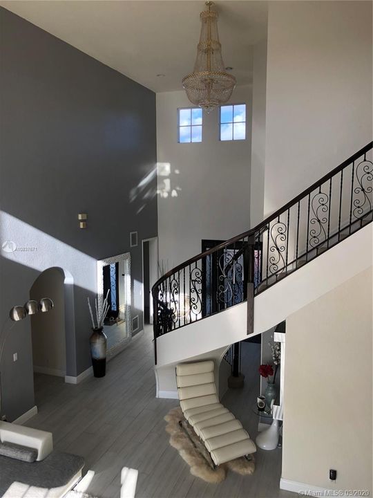 Wrought iron spiral stair case and gorgeous chandelier included in the sale