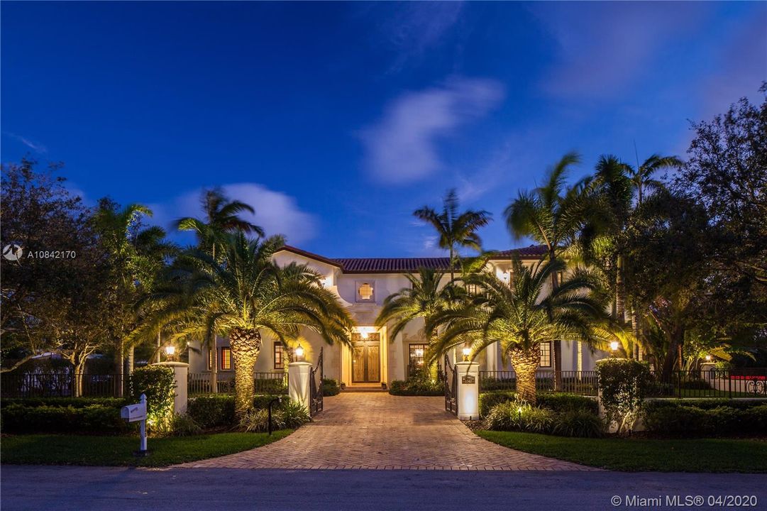Gated front entrance by dusk