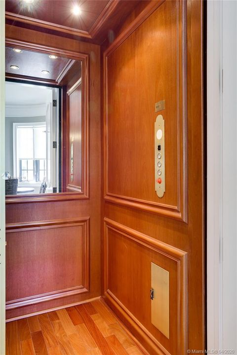 Elevator with cherry wood finish