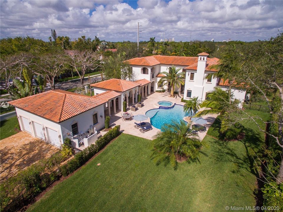 3 car garage and verdant yard